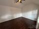 Bright bedroom with hardwood floors and neutral walls, ready for personalization at 4221 Hounds Run Dr, Matthews, NC 28105
