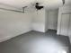 Spacious garage with a painted floor, fan, and good lighting at 4221 Hounds Run Dr, Matthews, NC 28105