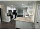 Modern kitchen with stainless appliances and granite counters that opens to the dining area at 4221 Hounds Run Dr, Matthews, NC 28105