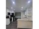 A kitchen with white cabinets, stainless steel appliances, granite countertops, and dark wood-look floors at 4221 Hounds Run Dr, Matthews, NC 28105