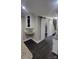 Kitchen area features white cabinets, granite countertops, stainless steel appliances, and dark wood-look floors at 4221 Hounds Run Dr, Matthews, NC 28105