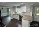 Well-lit kitchen featuring white cabinets, stainless steel appliances, and granite countertops at 4221 Hounds Run Dr, Matthews, NC 28105