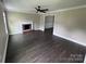 Inviting living room with fireplace, ceiling fan, and elegant crown molding at 4221 Hounds Run Dr, Matthews, NC 28105