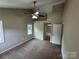 This main bedroom features a ceiling fan, neutral walls, and a door to the bathroom at 4221 Hounds Run Dr, Matthews, NC 28105