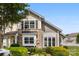 Attractive townhome showcasing a stone facade, well-maintained landscaping, and plenty of natural light at 448 River Park Rd, Belmont, NC 28012