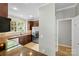 Modern kitchen featuring dark wood cabinets, granite countertops, and stainless steel appliances at 448 River Park Rd, Belmont, NC 28012