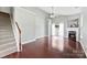 Bright living room features hardwood floors, a cozy fireplace, and a ceiling fan at 448 River Park Rd, Belmont, NC 28012