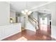 Open-concept living space with hardwood floors, elegant lighting, and staircase at 448 River Park Rd, Belmont, NC 28012