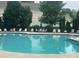 Community pool with lounge chairs and well maintained grounds at 448 River Park Rd, Belmont, NC 28012