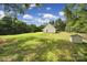 Spacious backyard featuring lush green grass and surrounding trees at 4592 Reid Rd, Edgemoor, SC 29712