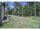 Large backyard featuring lush trees and green grass at 4592 Reid Rd, Edgemoor, SC 29712
