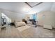 Spacious bedroom with wood floors, neutral colors, and large desk area at 4592 Reid Rd, Edgemoor, SC 29712