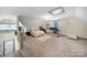 Spacious bedroom with wood floors, neutral colors, and large desk area at 4592 Reid Rd, Edgemoor, SC 29712