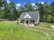 Charming home with inviting front porch and well-maintained lawn at 4592 Reid Rd, Edgemoor, SC 29712