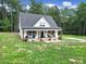 Charming home with inviting front porch and well-maintained lawn at 4592 Reid Rd, Edgemoor, SC 29712
