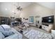 Spacious living room featuring high ceilings, wood floors, and modern furnishings at 4592 Reid Rd, Edgemoor, SC 29712