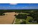 Drone's-eye view of home with extensive fields and forests, merging rural lifestyle with privacy at 4713 White Store Rd, Wingate, NC 28174