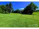 Lush green field with sturdy fence posts under a bright blue sky offers potential at 4713 White Store Rd, Wingate, NC 28174