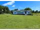 Charming single-story home with a well-maintained lawn, front porch, and traditional architecture at 4713 White Store Rd, Wingate, NC 28174
