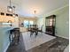 Eat-in kitchen featuring an island with stool seating, modern light fixtures, and stylish decor at 4713 White Store Rd, Wingate, NC 28174