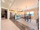 Spacious eat-in kitchen featuring an island with stool seating, wood flooring, and modern appliances at 4713 White Store Rd, Wingate, NC 28174