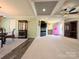 Inviting living space with a pink front door, fireplace, television, and decorative furnishings at 4713 White Store Rd, Wingate, NC 28174