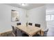 Bright dining room with natural light, featuring a classic table set for six at 4806 Spring Lake Dr # D, Charlotte, NC 28212