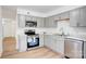 Modern kitchen with gray cabinetry, stainless steel appliances and ample counter space at 4806 Spring Lake Dr # D, Charlotte, NC 28212