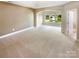 Bedroom boasting large windows, neutral carpet and natural light at 5003 Tremont Dr, Indian Trail, NC 28079