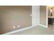 Bedroom with neutral walls and carpet, looking into the bathroom at 5003 Tremont Dr, Indian Trail, NC 28079