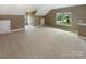 Spacious bonus room features neutral carpet and trim plus natural light at 5003 Tremont Dr, Indian Trail, NC 28079
