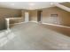 Spacious bonus room features neutral carpet and trim plus natural light at 5003 Tremont Dr, Indian Trail, NC 28079