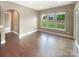 Living room with hardwood floors and a view to the landscaped backyard at 5003 Tremont Dr, Indian Trail, NC 28079