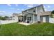 Spacious backyard with a screened-in porch, patio, and well-maintained lawn, perfect for outdoor activities at 5069 Thomasville Dr, Belmont, NC 28012