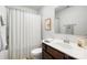 Bathroom featuring a shower with white curtain, vanity with a sink, mirror, and light fixture at 5069 Thomasville Dr, Belmont, NC 28012
