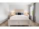 This bedroom offers natural light with a large bed, side tables, and bright window at 5069 Thomasville Dr, Belmont, NC 28012