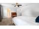 Bedroom featuring neutral walls, carpet, and a large bed, with access to bathroom at 5069 Thomasville Dr, Belmont, NC 28012
