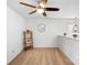 Bright bonus room featuring neutral walls, carpet, ceiling fan, and decorative shelving and wall decor at 5069 Thomasville Dr, Belmont, NC 28012