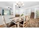 Cozy dining area with a wooden table, leading to the living room and staircase at 5069 Thomasville Dr, Belmont, NC 28012
