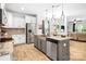 Contemporary kitchen with stainless steel appliances, granite counters, and a stylish island with barstool seating at 5069 Thomasville Dr, Belmont, NC 28012