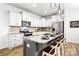 Bright, modern kitchen featuring granite countertops, stainless steel appliances, and an island with barstool seating at 5069 Thomasville Dr, Belmont, NC 28012