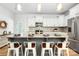 Stylish kitchen island with granite countertops, white cabinets and seating for four at 5069 Thomasville Dr, Belmont, NC 28012