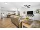 Open-concept living room showcasing modern decor and a seamless flow to the kitchen at 5069 Thomasville Dr, Belmont, NC 28012