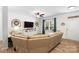 Inviting living room boasts a comfortable leather sofa, stylish decor, a ceiling fan, and bright natural light at 5069 Thomasville Dr, Belmont, NC 28012