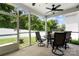 Relaxing screened porch with patio furniture, offering a peaceful outdoor space at 5069 Thomasville Dr, Belmont, NC 28012