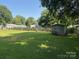 Spacious backyard with storage shed, perfect for outdoor activities and relaxation at 5722 Oak Dr, Charlotte, NC 28216