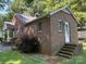 Lovely brick home with manicured landscaping, exuding curb appeal and charm at 5722 Oak Dr, Charlotte, NC 28216