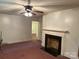 An open living room featuring a fireplace and carpet at 5722 Oak Dr, Charlotte, NC 28216