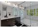 Modern bathroom featuring a double vanity, marble walk-in shower, and stylish fixtures at 615 N Oak Dr, Huntersville, NC 28078