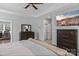 Relaxing primary bedroom with an ensuite bathroom and dresser with a television at 615 N Oak Dr, Huntersville, NC 28078